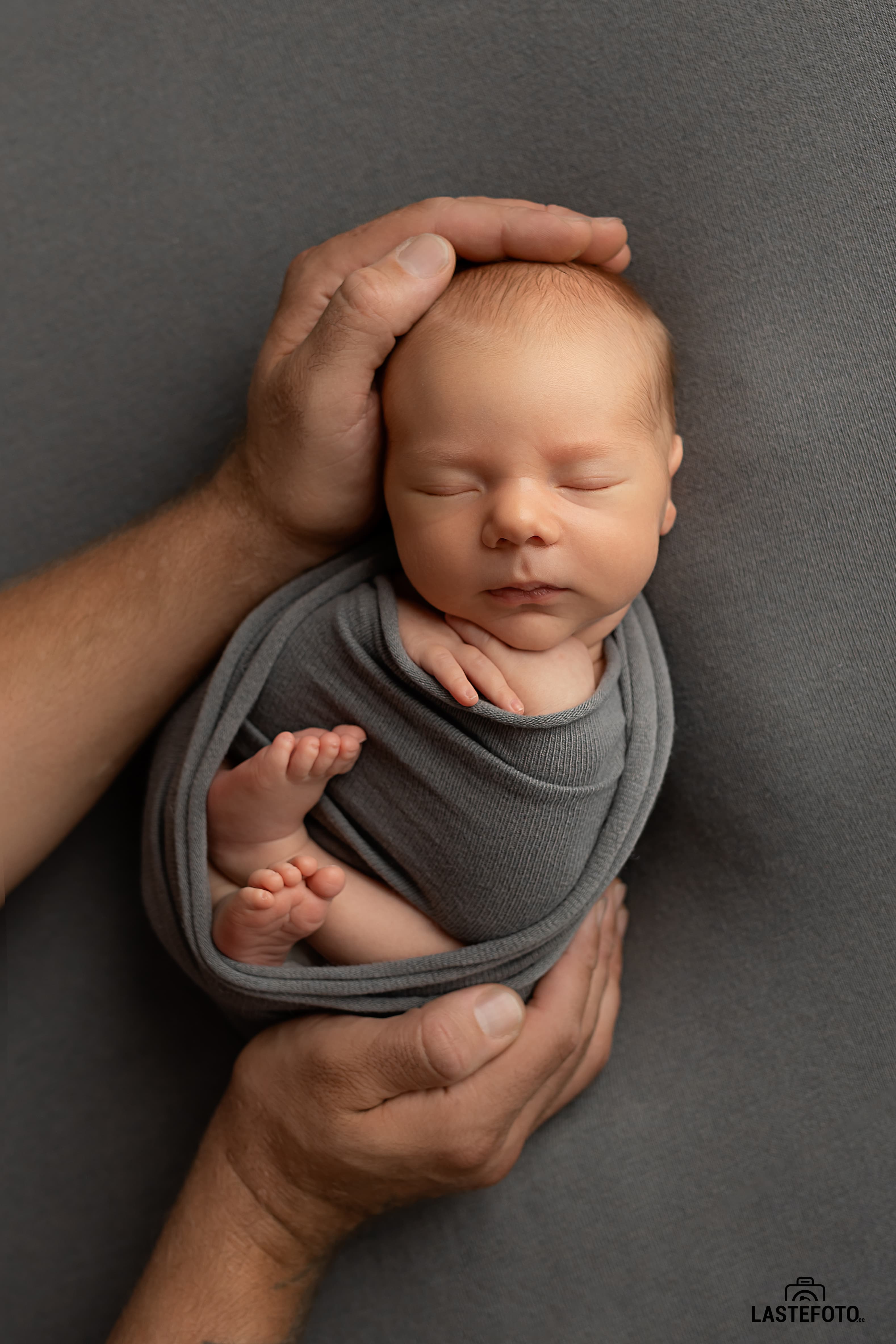 Newborn in father's arms